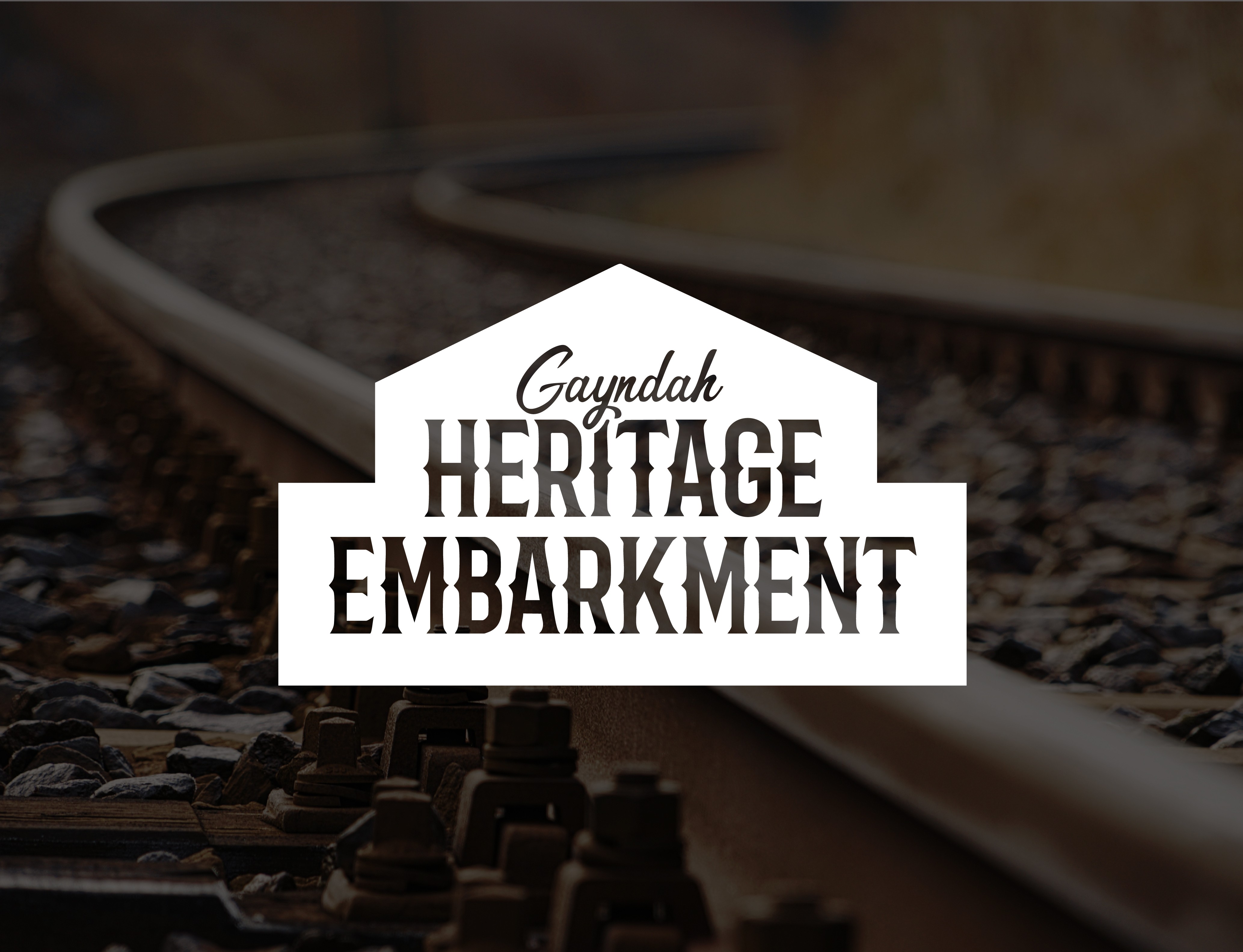 Gayndah Heritage Embarkment logo in front of train track image